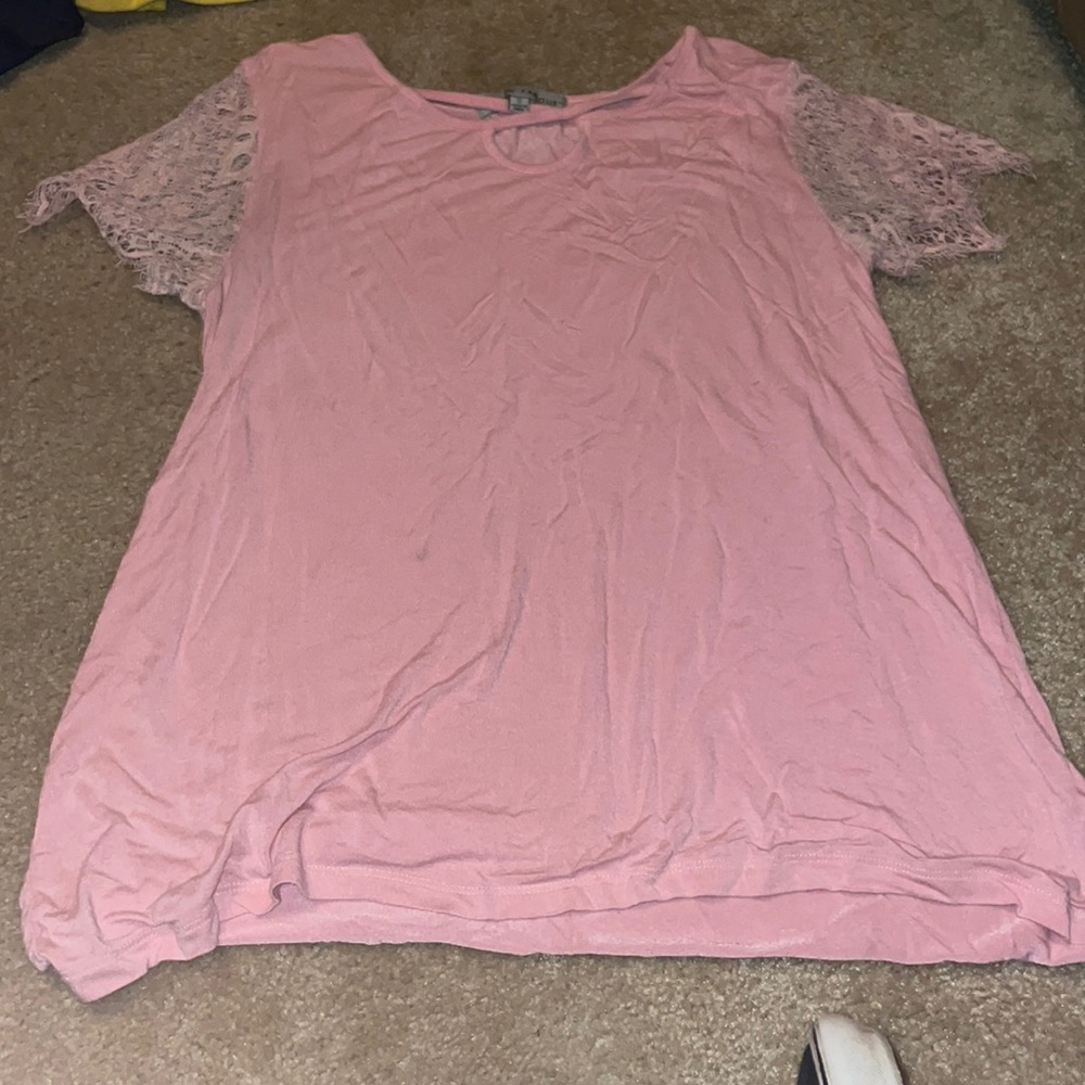 A pink shirt it is a small
